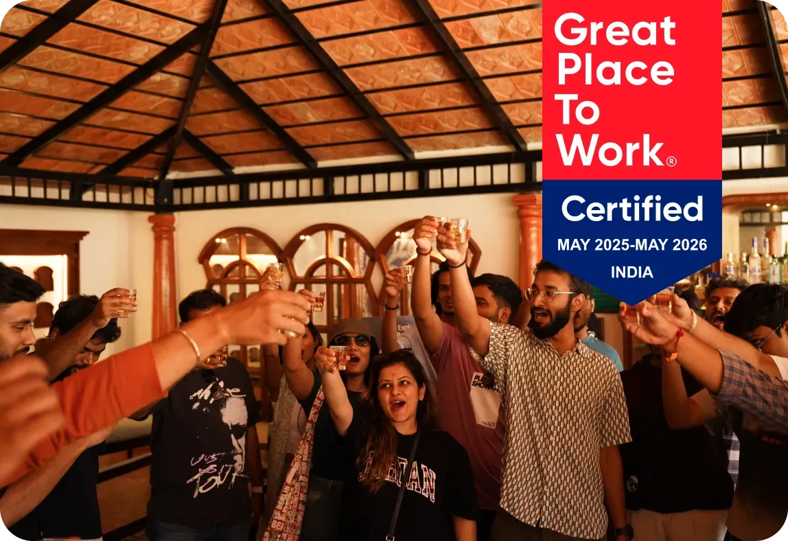 The Gushwork team raising a toast, with the Great Place To Work Certified badge